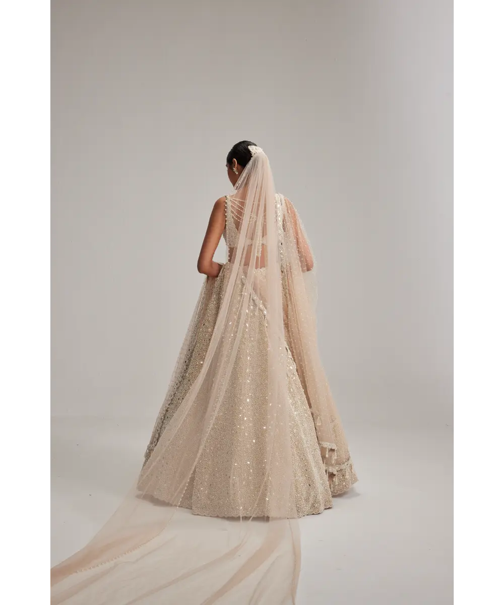 VVANI VATS- Light Beige Dense mirror and pearl lehenga set with Double Dupatta and Veil